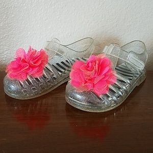 Clear sparkly jelly sandals with pink flower